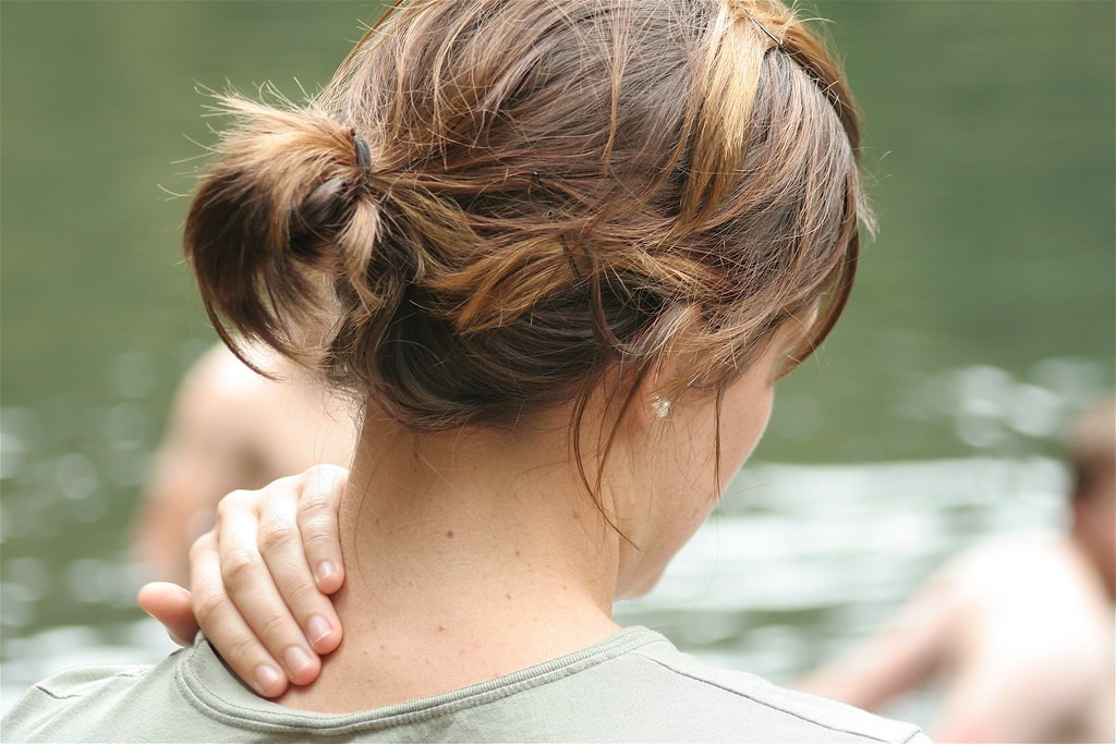 Woman massaging painful neck