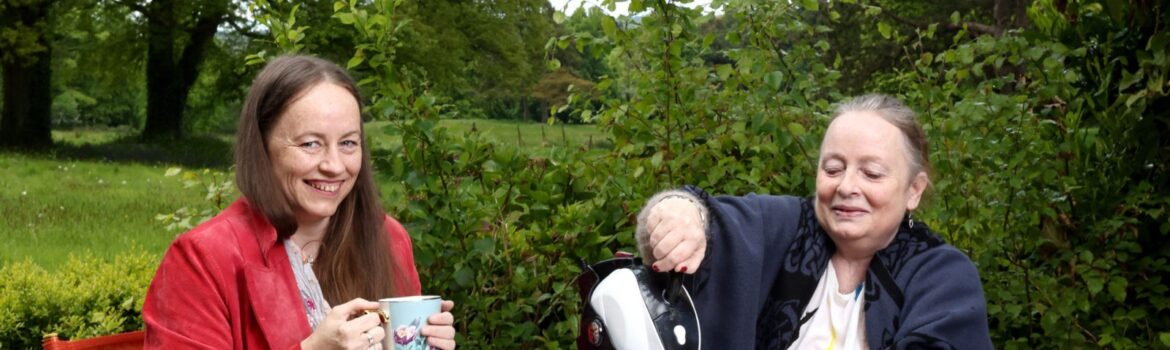 Mother and Daughter sitting in the garden having tea with their Uccello Kettle