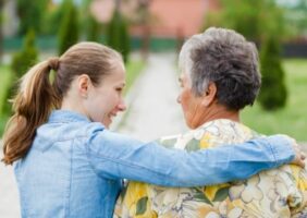 Young woman caring for elderly woman