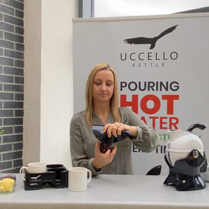 Lady using the Uccello Grip Mat to open a jar lid