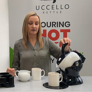 Lady using the tilt-to-pour Uccello Kettle