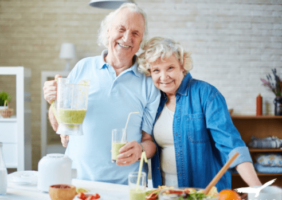 Elderly couple enjoying smoothies