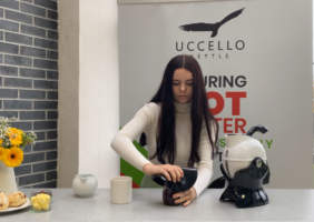 Woman using the Uccello Grip Mat in the ktichen to open a jar